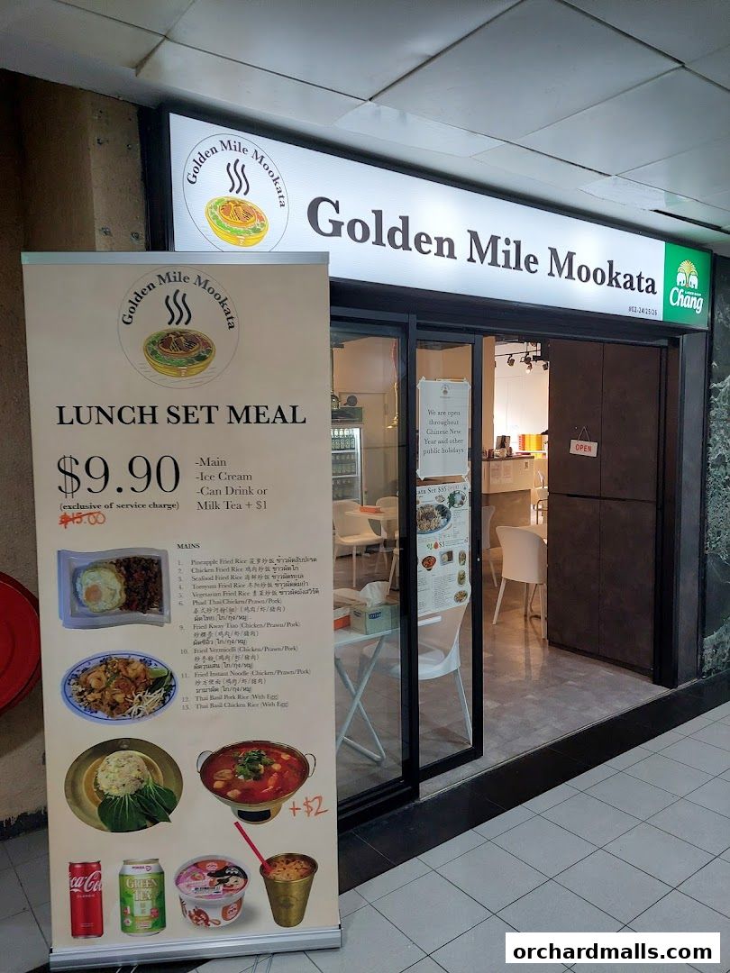 A shop front for Golden Mile Mookata Thai Food with a prominent lunch set meal promotion banner.
