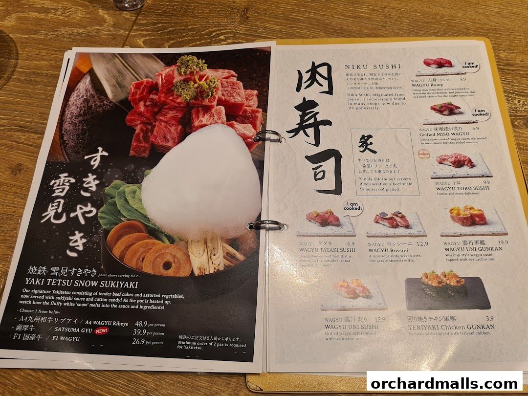 A menu featuring Niku Sushi and Yaki Tetsu Snow Sukiyaki with detailed descriptions and prices.