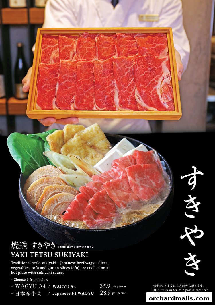 A close-up of a sukiyaki dish with thinly sliced wagyu beef and vegetables.