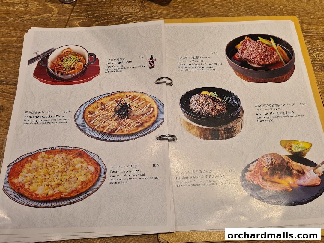 A menu from Niku Kappo featuring various Japanese dishes like pizza, steak, and grilled squid.