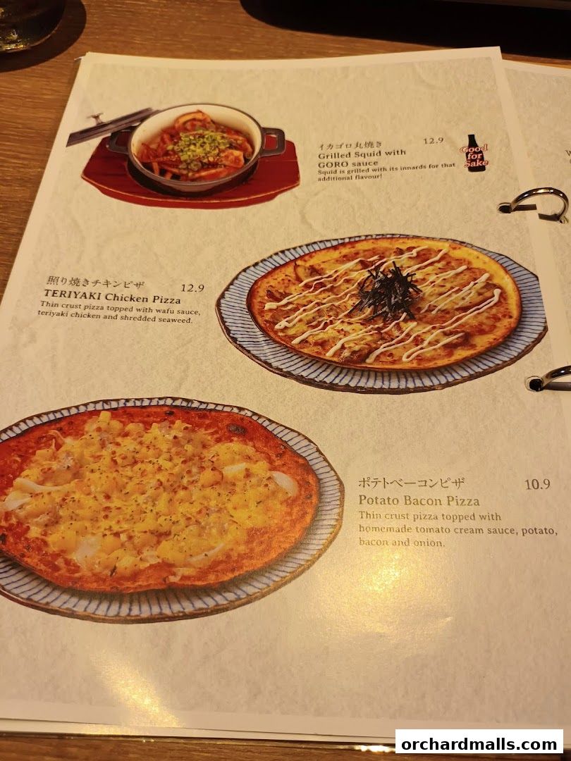 A menu page from Niku Kappo featuring pizzas and grilled squid.