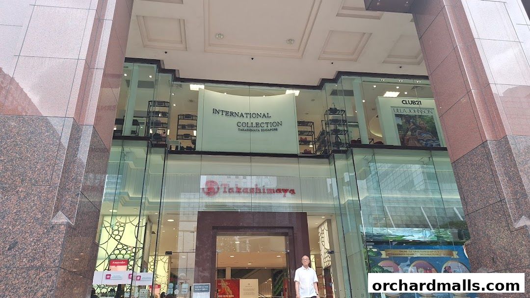 Exterior view of Takashimaya department store with 'International Collection' and 'Club 21' signage.