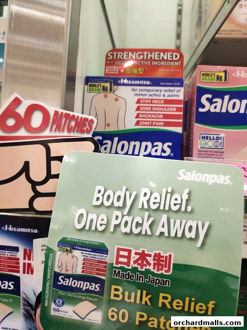 A display of Salonpas pain relief patches, highlighting bulk relief and Japanese origin.