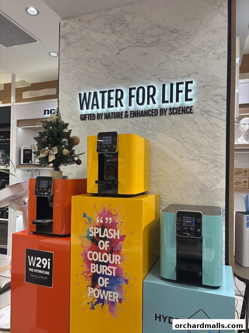 Display of colorful water purifiers with the slogan 'Water for Life'.