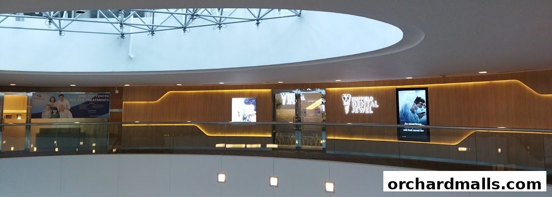 The exterior of Nuffield Dental Jewel, a modern dental clinic with illuminated signage.