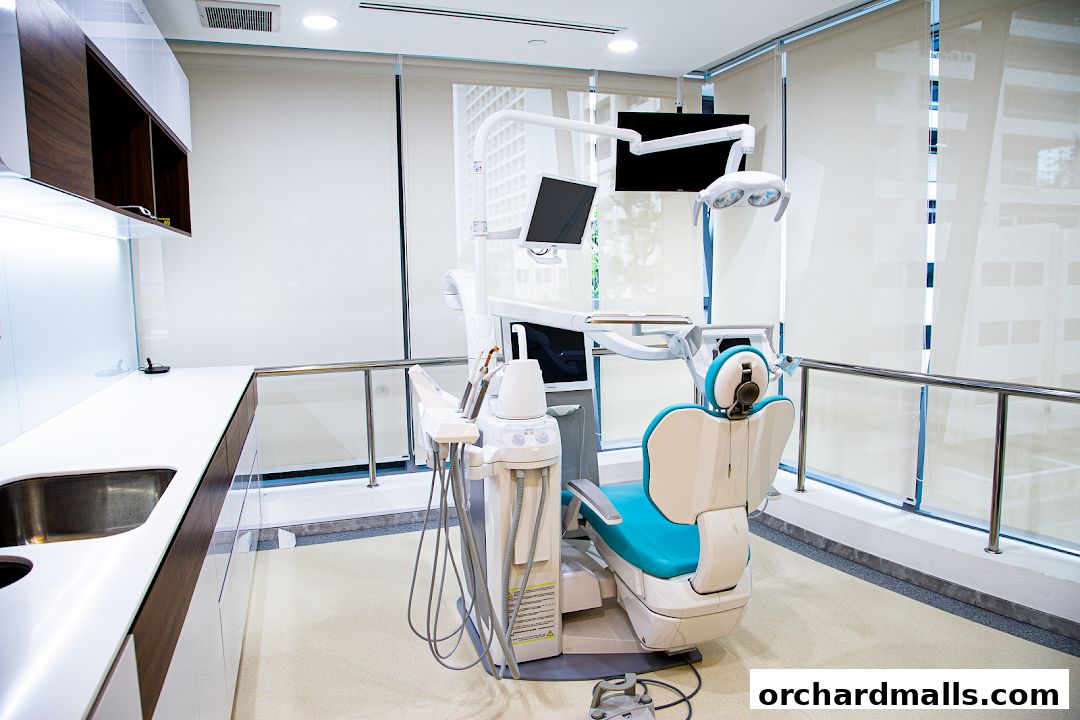 A modern dental examination room with a dental chair and equipment.