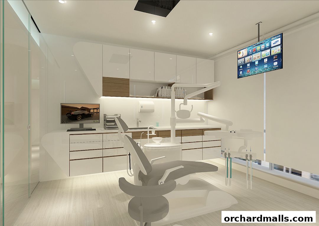 Modern dental clinic interior with a dental chair, equipment, and a TV screen.