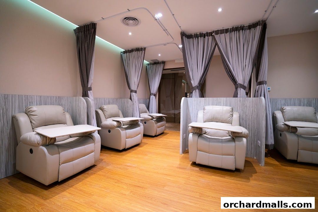 Comfortable reclining chairs with trays in a clean, modern medical spa setting.