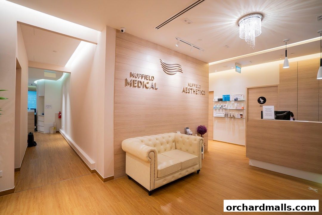 Interior view of Nuffield Medical Aesthetics reception area with a sofa and reception desk.