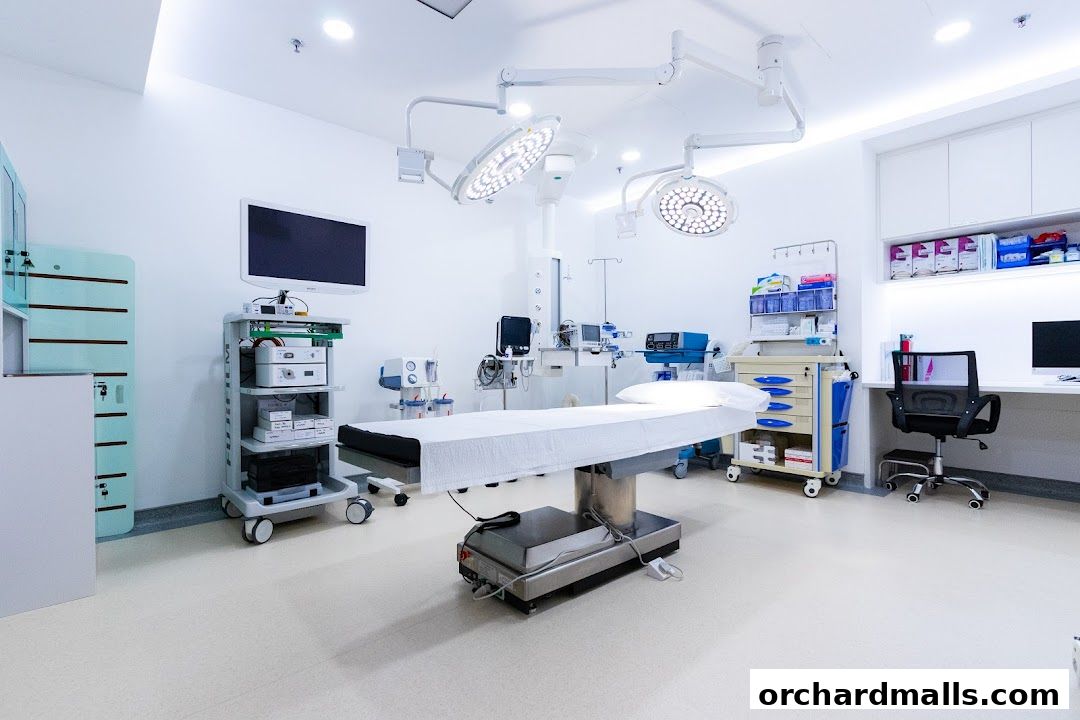 A modern operating room with a surgical table, medical equipment, and bright lighting.