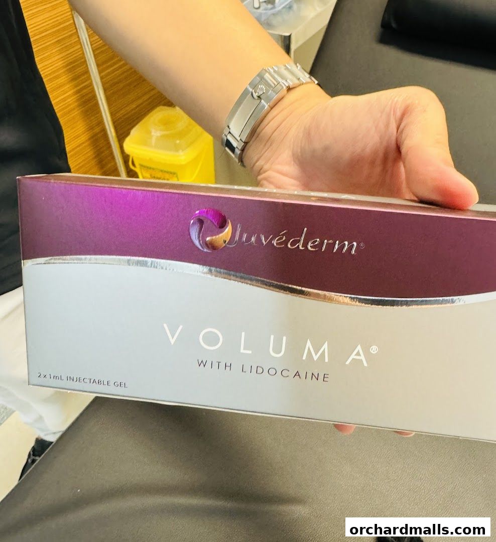 A person holds a box of Juvederm Voluma with Lidocaine injectable gel.