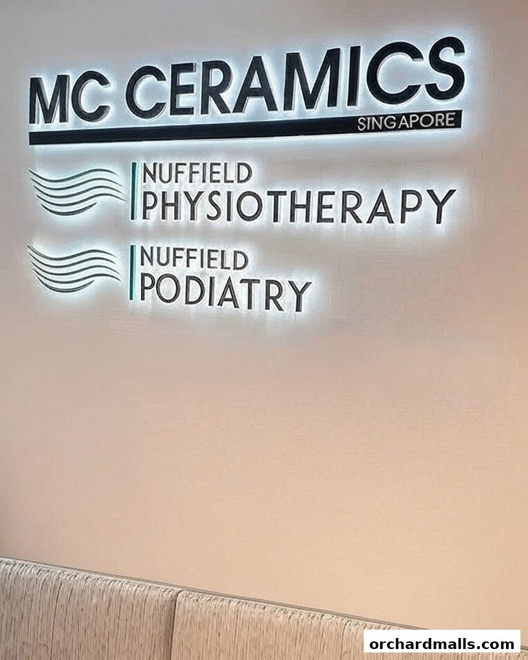 Illuminated signs for MC Ceramics, Nuffield Physiotherapy, and Nuffield Podiatry.