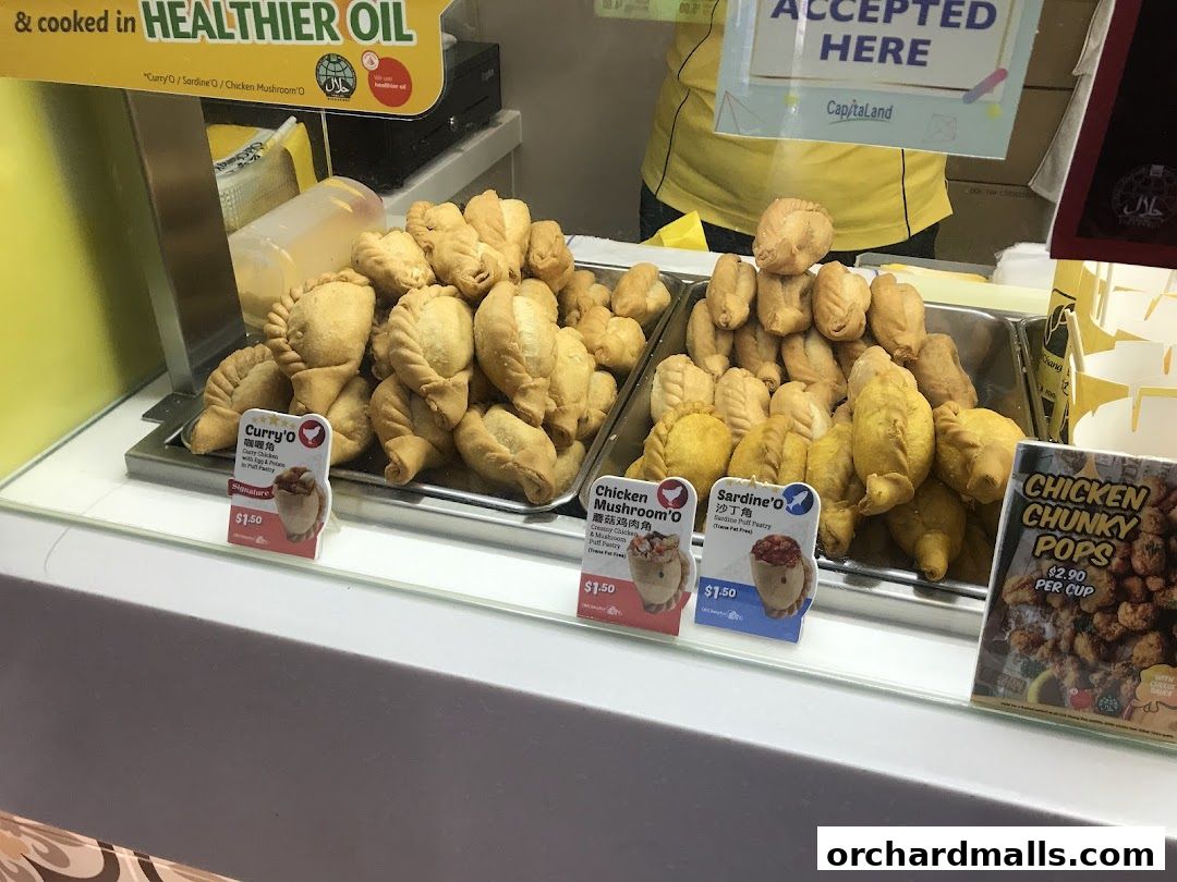 A display of freshly fried pastries and chicken chunks at Old Chang Kee.
