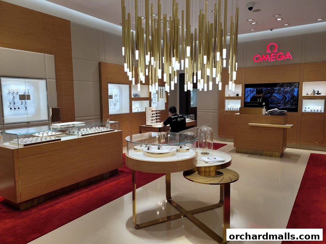 Interior of an OMEGA watch store with display cases and a prominent OMEGA logo.