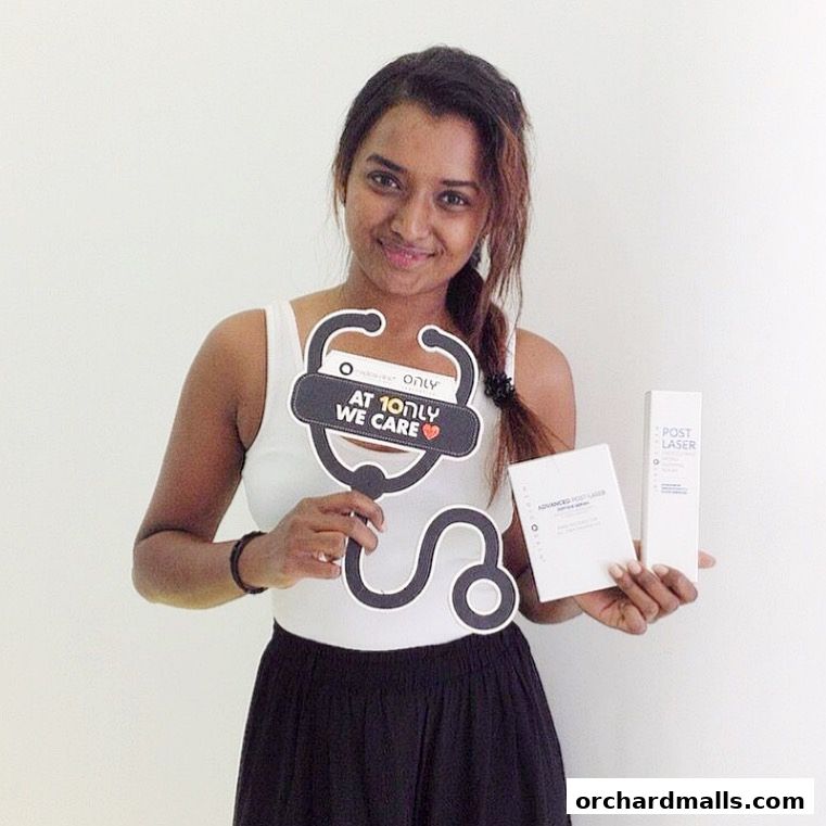 A woman holds a stethoscope prop and products from Only Aesthetics.