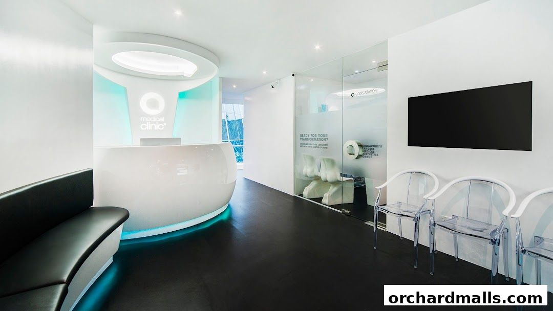 Modern reception area of a medical aesthetics clinic with a sleek counter and waiting chairs.