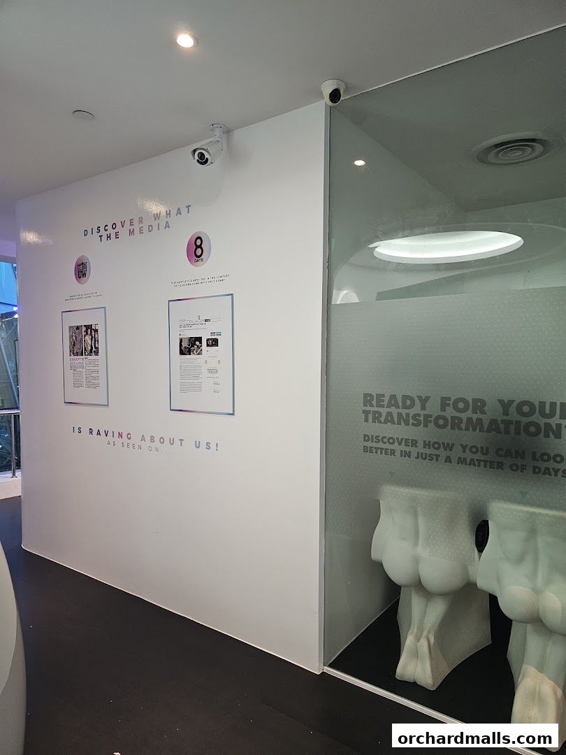 Shop interior with media mentions and display of anatomical models.