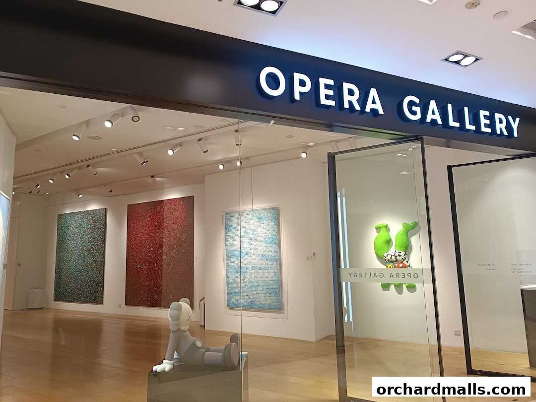 The entrance of Opera Gallery Singapore, showcasing contemporary art and sculptures.