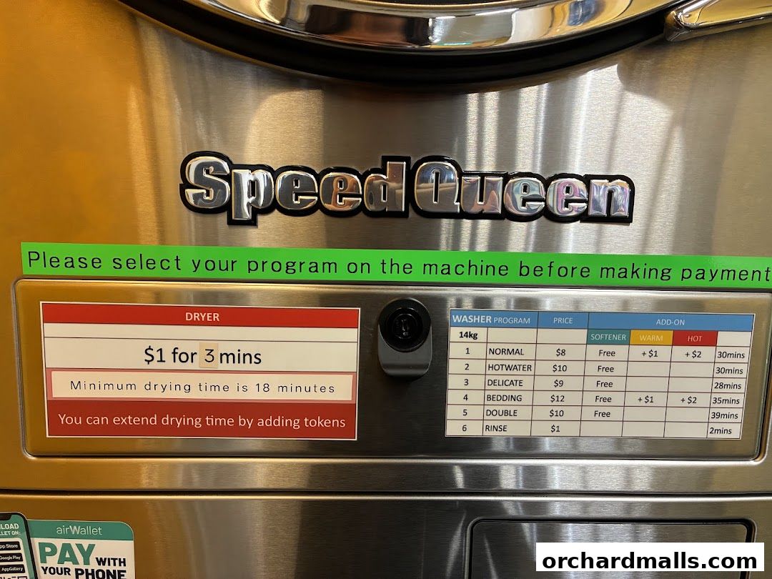 Close-up of a Speed Queen washing machine with pricing and program details.