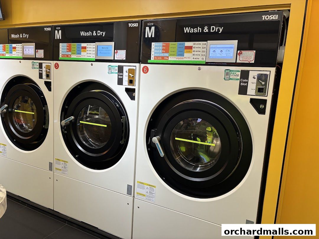 Row of modern Tosei Wash & Dry machines with pricing displayed.