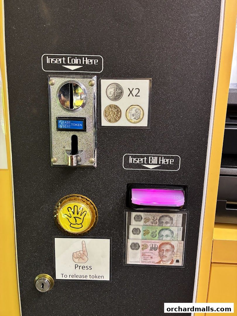 A coin and bill acceptor machine with instructions for inserting currency and releasing tokens.