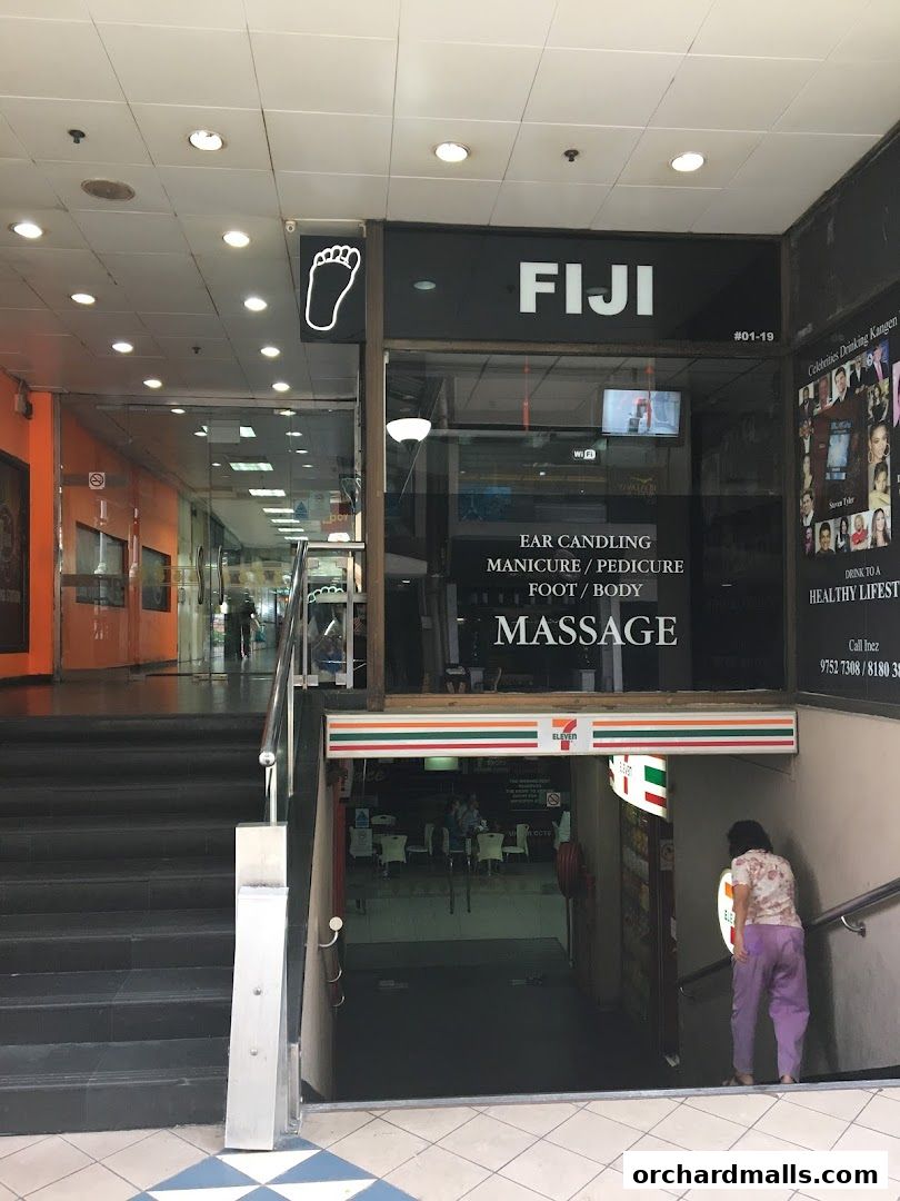 The entrance to Orchard Massage by Fiji, offering various services like ear candling and massage.