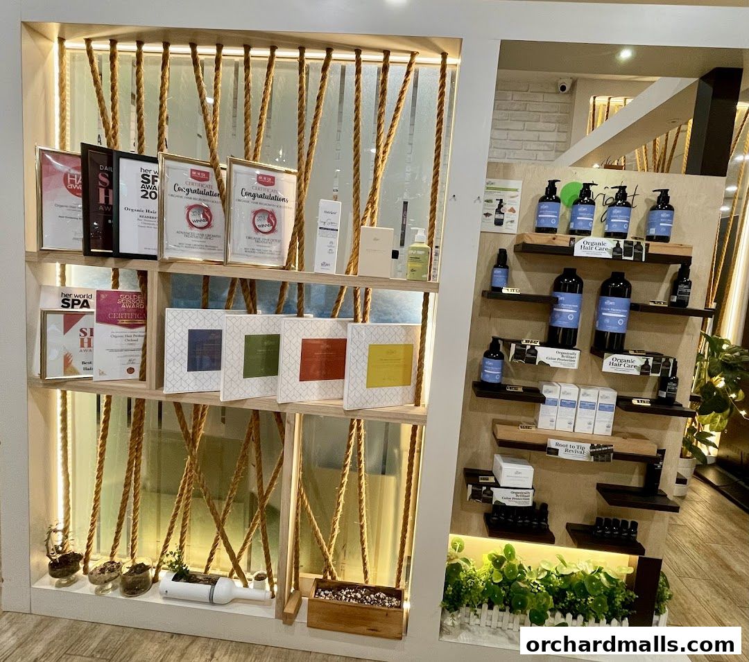 Display shelves showcasing organic hair care products, awards, and decorative elements.