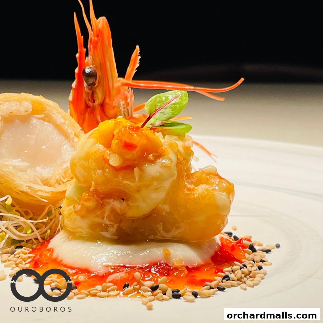 A beautifully plated dish featuring a large shrimp and a crispy seafood creation.