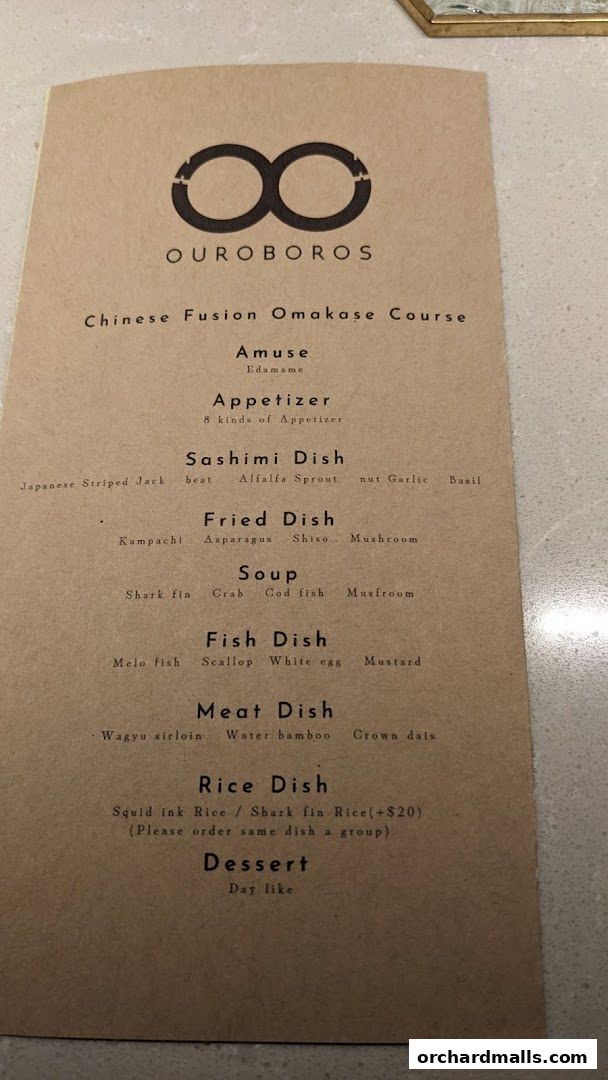 A menu for OUROBOROS, a Chinese Fusion Omakase restaurant, listing various dishes.