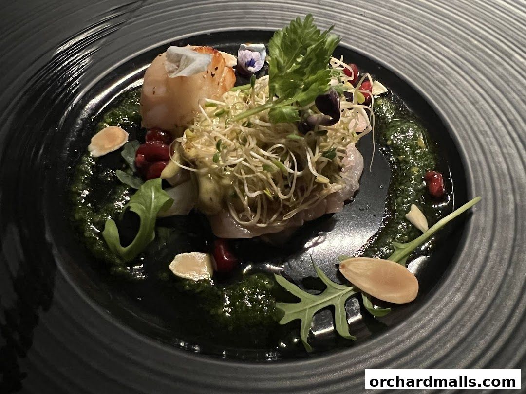A beautifully plated dish with seafood, sprouts, and garnishes on a dark plate.