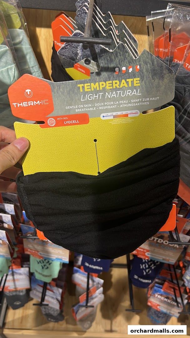 A black neck gaiter with a Therm-ic temperate light natural tag, made with 96% Lyocell.