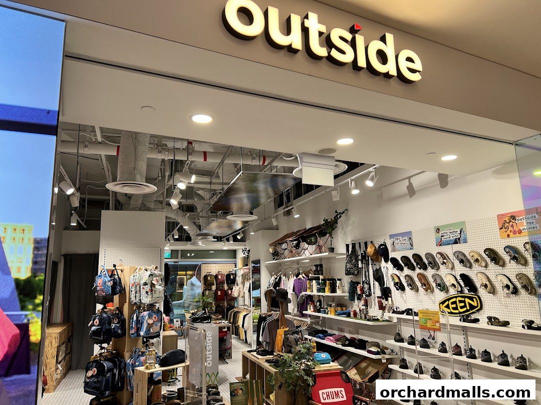 Exterior view of 'Outside Wheelock The Outdoor Shop' showcasing outdoor gear and apparel.