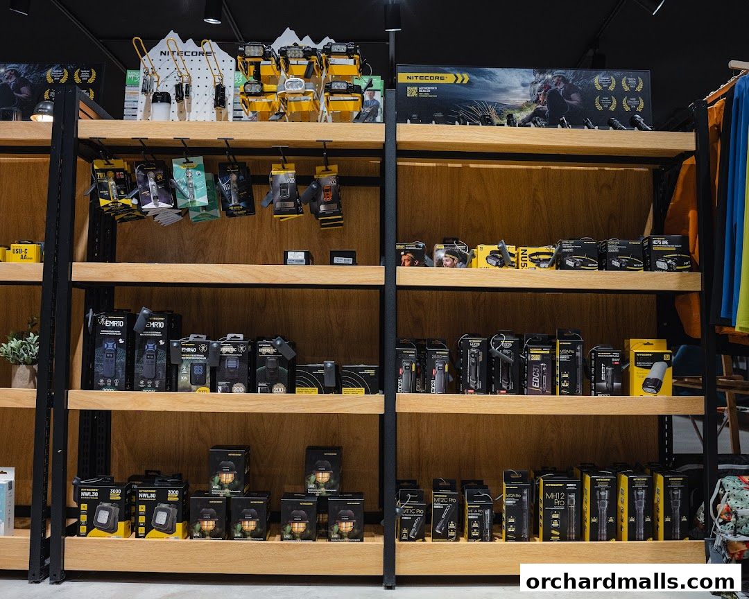 Shelves stocked with Nitecore flashlights and outdoor lighting equipment.
