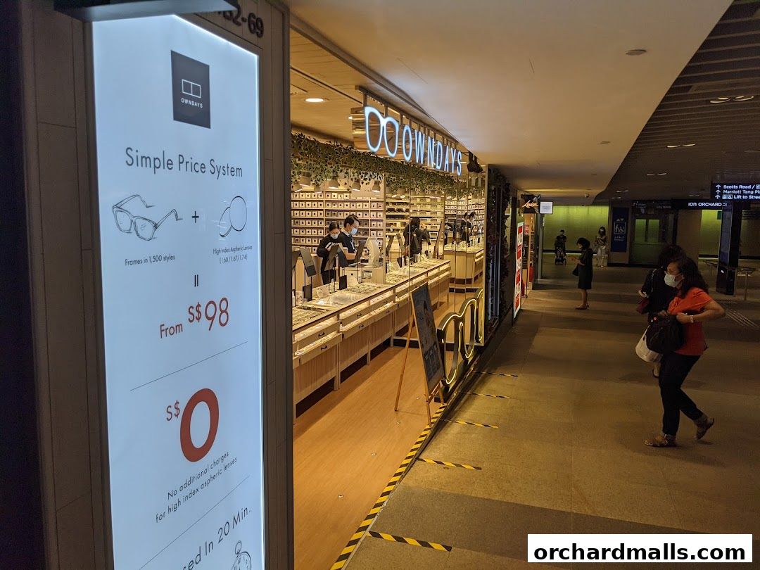 The OWNDAYS shop front displays a simple price system for eyeglasses and lenses.
