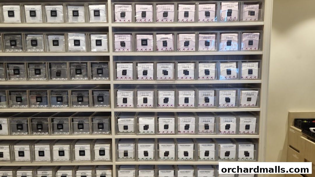 Neatly organized shelves displaying numerous eyewear frames in individual packaging.