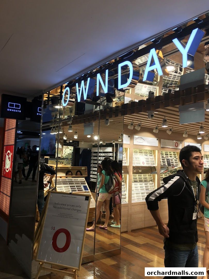 A bright and modern eyewear shop with a prominent "OWNDAYS" sign and displays of glasses.