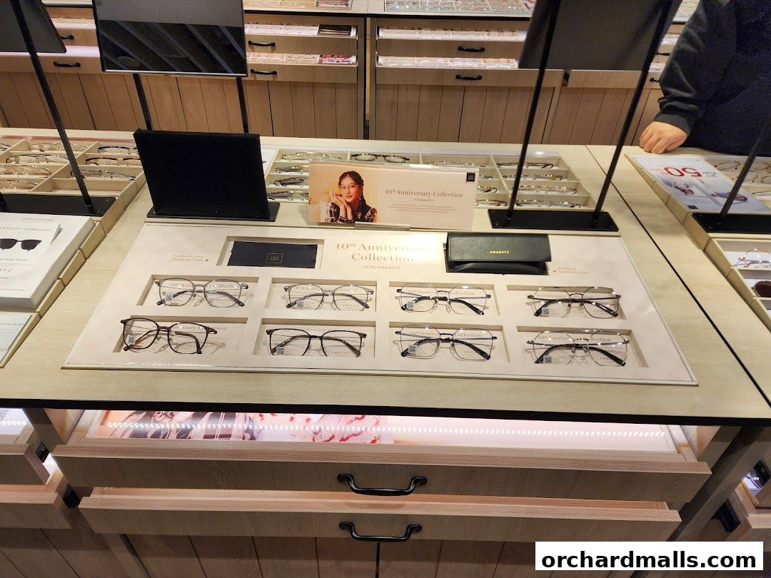 A display of various eyeglasses from OWNDAYS, featuring a 10th Anniversary Collection.