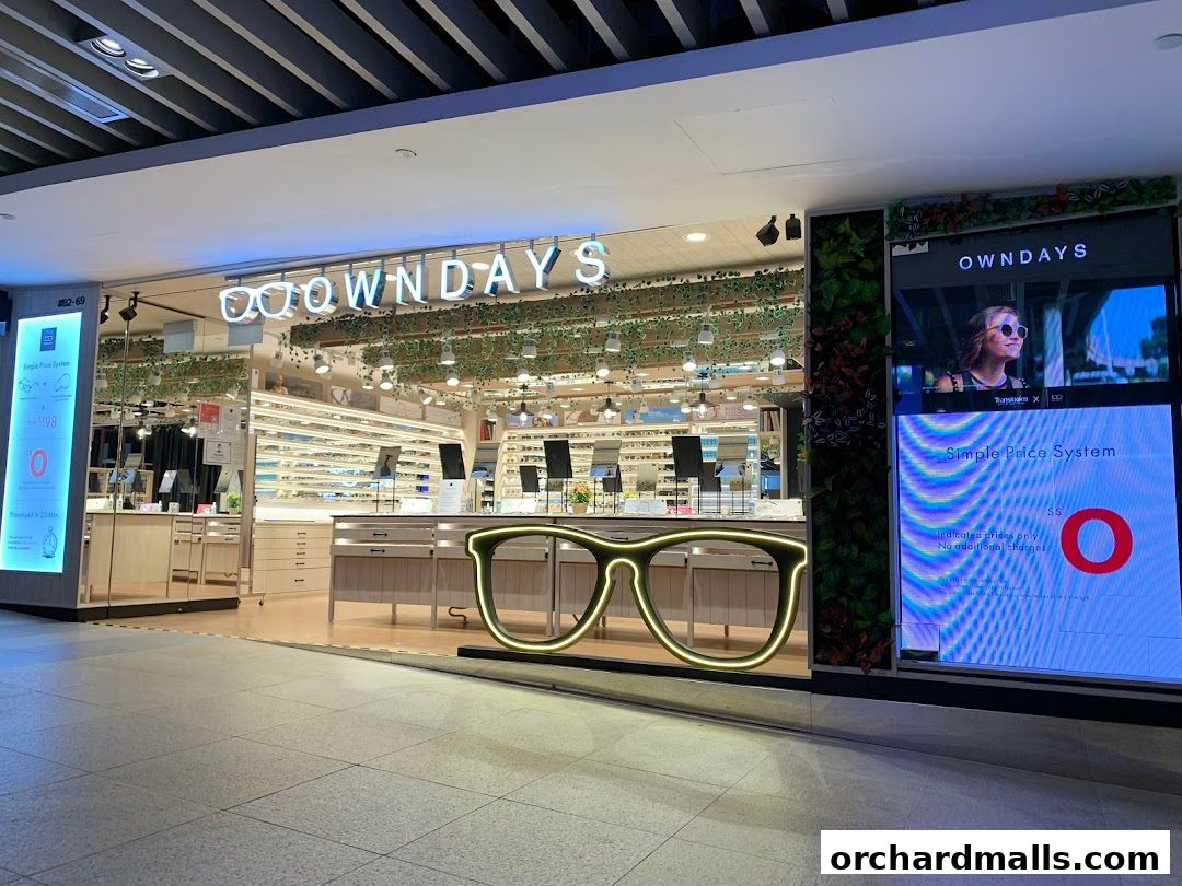 The OWNDAYS ION Orchard shop front displays a wide selection of eyeglasses and a large illuminated glasses frame.