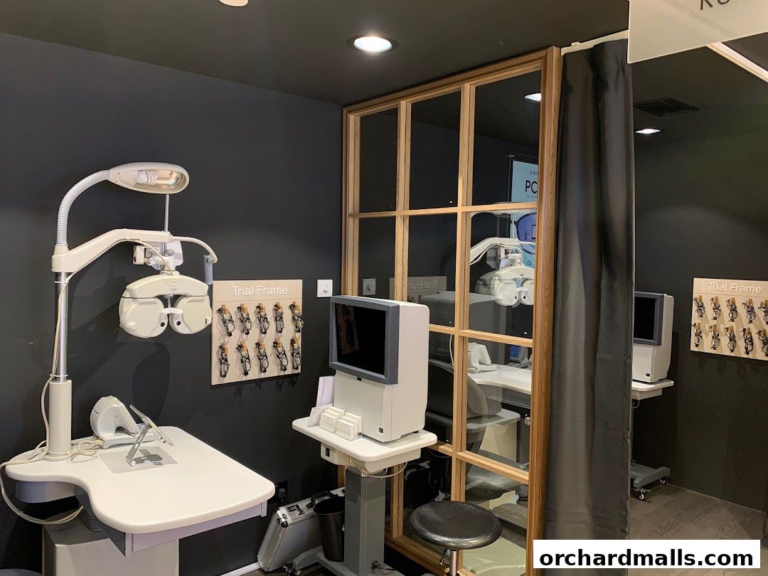 Interior of an optical shop with eye examination equipment and trial frames.
