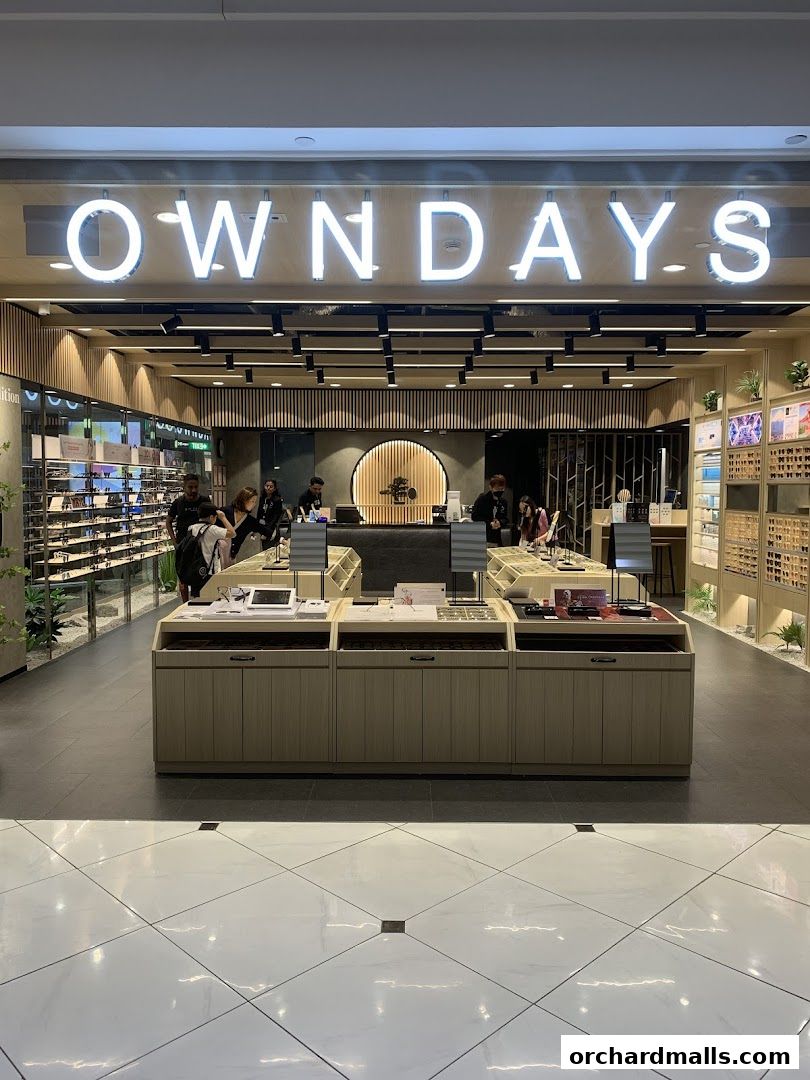 Interior view of OWNDAYS Takashimaya S.C. optical shop with displays of eyewear.