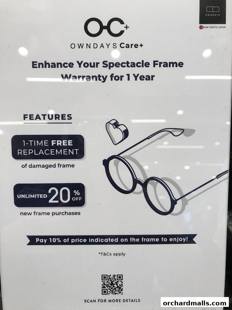 A sign advertising OWNDAYS Care+ with features like free replacement and discounts.