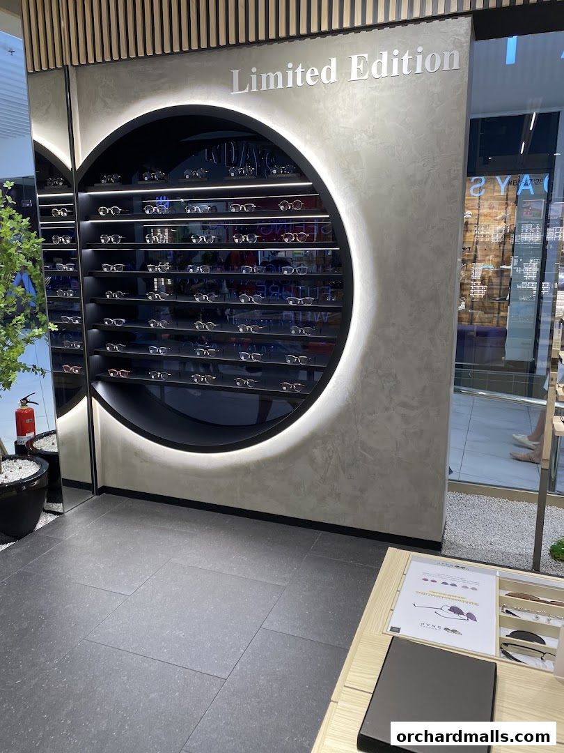 Eyewear display featuring a circular shelf with various glasses and a 'Limited Edition' sign.