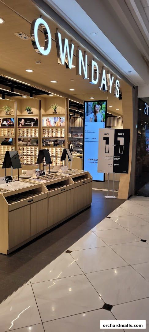Modern eyewear store with a wide selection of glasses displayed.