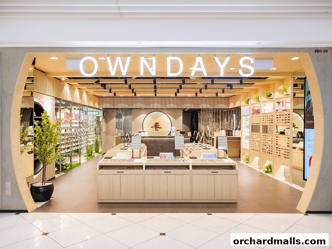 The interior of a modern eyewear shop, OWNDAYS, displaying a wide selection of glasses.