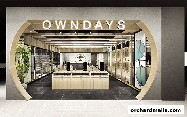 The entrance of OWNDAYS Takashimaya S.C, an optical shop with a modern, minimalist design.