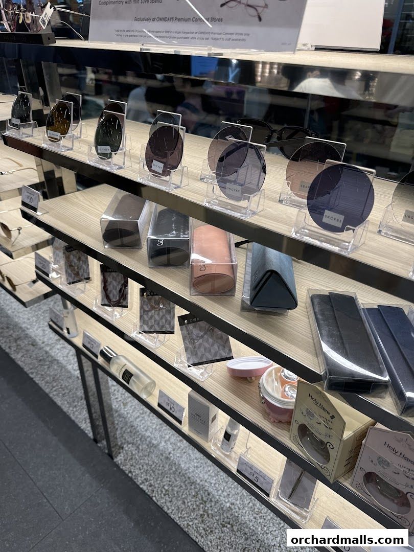 Display shelves showcasing various eyewear lenses, cases, and accessories at OWNDAYS.