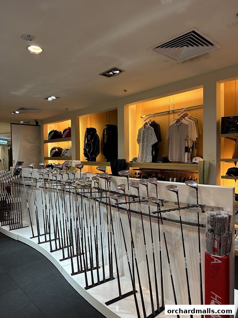 Interior view of a golf shop displaying a wide selection of golf clubs and apparel.
