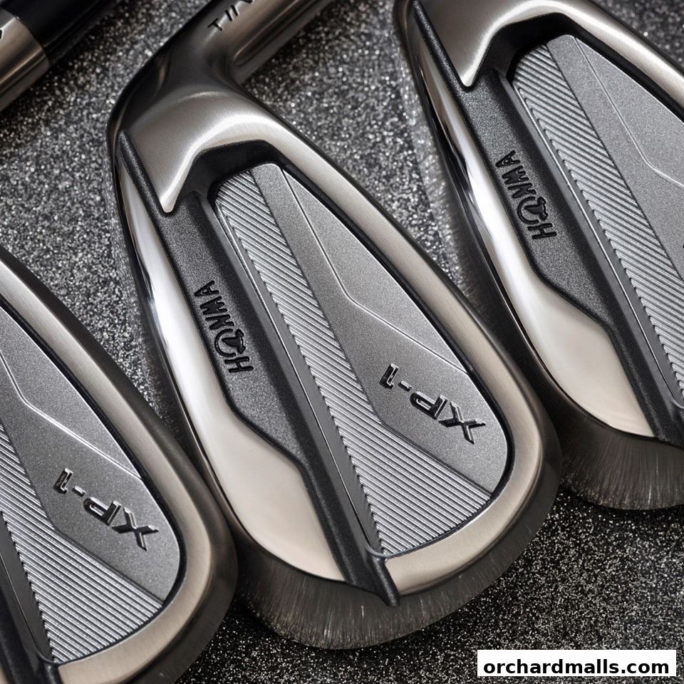 Close-up view of Honma XP-1 golf irons, showcasing their sleek design and branding.