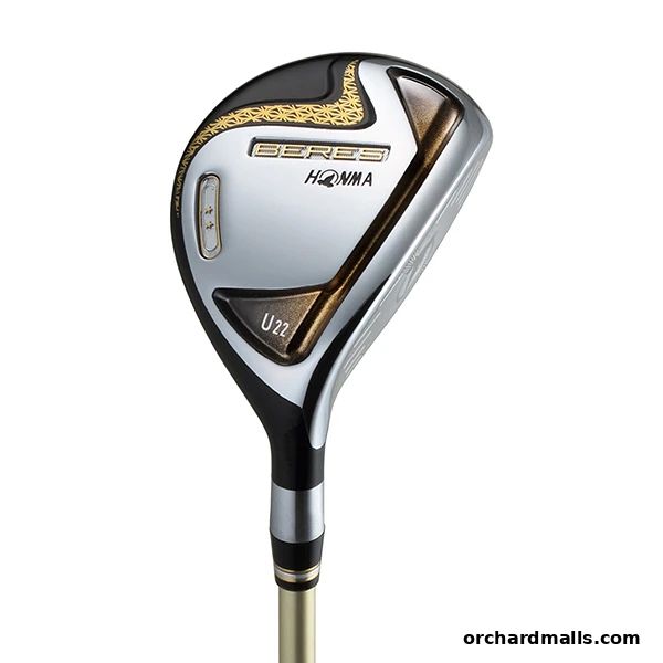 A close-up studio shot of a silver and black golf club with gold accents.