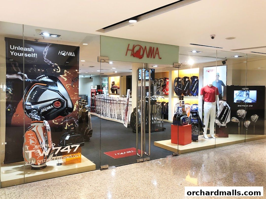 The entrance of a Pan-West Honma golf equipment store, showcasing clubs, bags, and apparel.